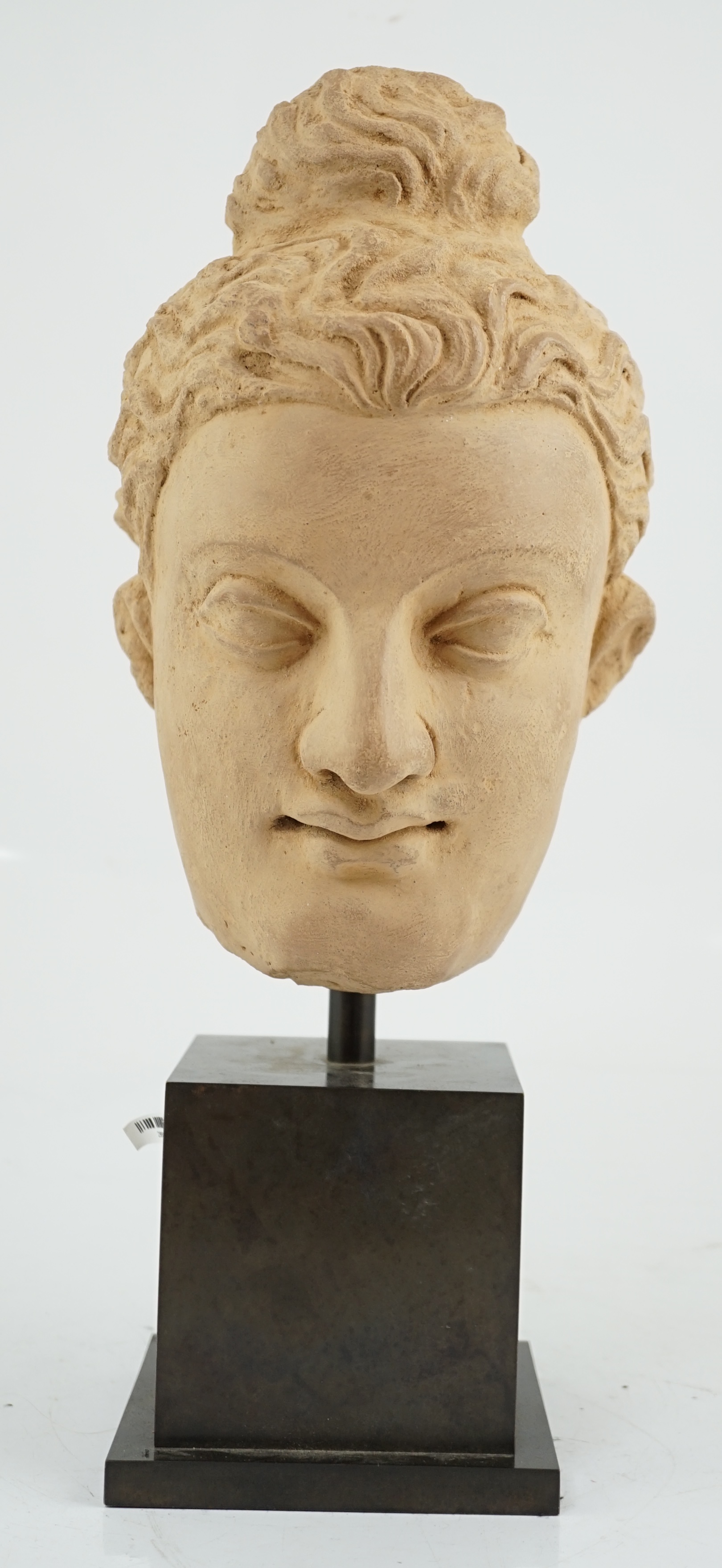 A stucco head of Buddha, Gandhara, Kushan period, 3rd/4th century AD